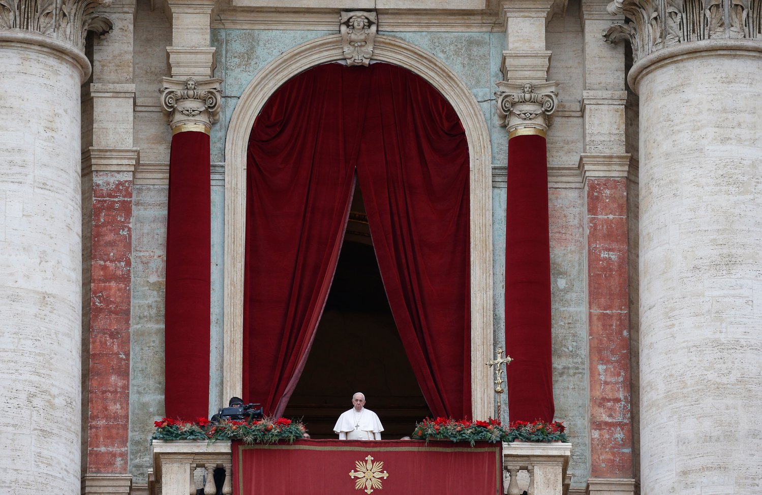 Pope Francis leads his Christmas message and blessing “urbi et orbi” (to the city and the world) from the central balcony of St. Peter’s Basilica at the Vatican Dec. 25.